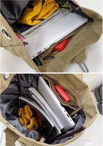 Detailed interior of khaki canvas backpack showing spacious compartments for laptop and books