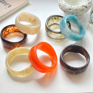 Minimalist wide chunky irregular resin bangles in various marble and tortoiseshell patterns
