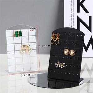 Macro view of 13.3cm acrylic earring stand with 48 holes in black and clear