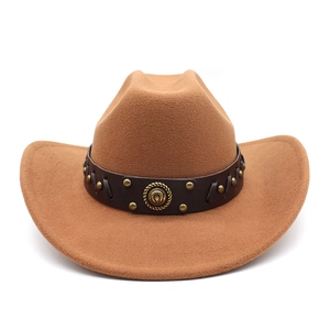 Close-up of brown wool western cowboy hat with leather studded band and horseshoe emblem