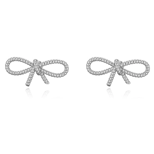 Detail of silver bow earrings featuring a textured rope twist design on white background