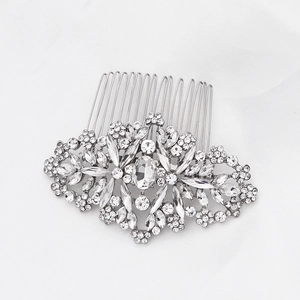 Detailed view of silver bridal hair comb with intricate rhinestone flower and vine patterns