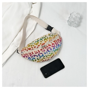 Detail of colorful leopard print straw waist bag with adjustable strap and buckle