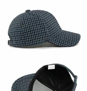 Detail of houndstooth baseball cap showing interior lining and metal adjustable buckle