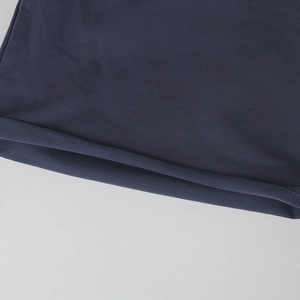 Close-up of the high-quality cotton fabric and clean hem stitching of the navy blue beanie