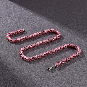 Detail of red and silver 5mm Byzantine chain link necklace with lobster clasp