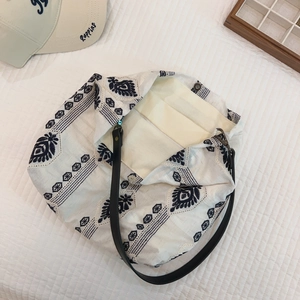 Detail view of ethnic embroidery tote bag interior showing beige lining and inner pocket