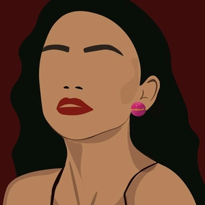 Detailed view of pink ball stud earrings with gold chain accent on a model's ear