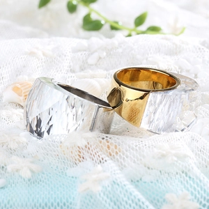 Classic chunky crystal rings set in gold and silver finish on elegant lace background