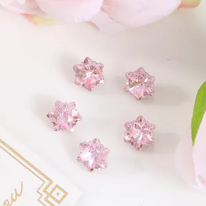 Macro detail of 10x10mm pink star-shaped faceted crystal for French style nail art decor