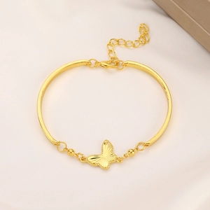 Elegant gold butterfly bracelet featuring a half-bangle design with adjustable extension chain