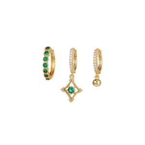 Detail view of gold earring set with green emerald stones and cubic zirconia charms