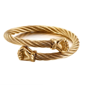 Golden titanium steel cable bangle with twin boxing glove accents and twisted wire texture
