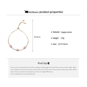 Detail view of rose gold pull-adjuster bracelet with three pink oval zircon stones