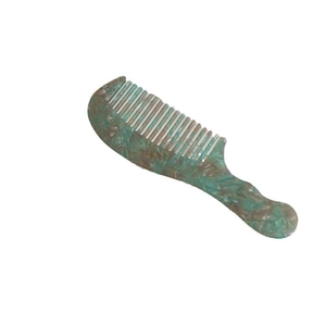 Portable acetate hair comb with green tortoise shell pattern on a clean white background