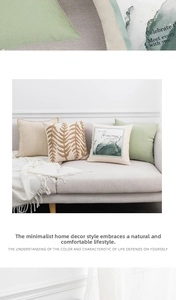 Detailed view of Nordic embroidered linen pillow covers with leaf patterns and textures