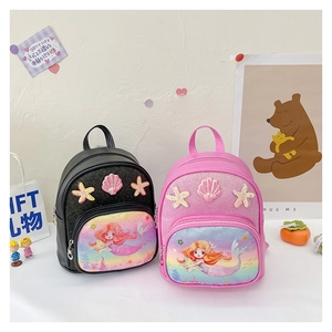 Close-up of pink and black mermaid backpacks with glitter shell and starfish patches