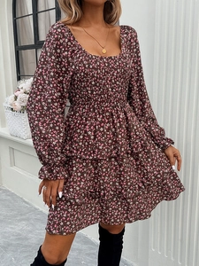 Detail of floral mini dress with square neck and elastic smocked waist detail