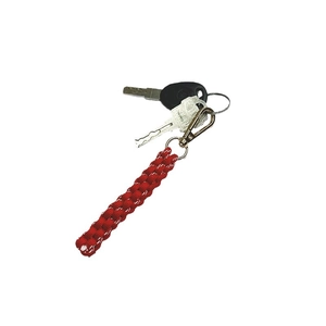 Handmade red braided cord keychain with durable metal hardware on a white background