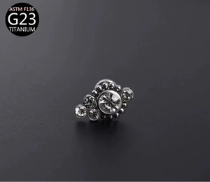 Macro view of G23 titanium labret stud featuring five sparkling zircon stones