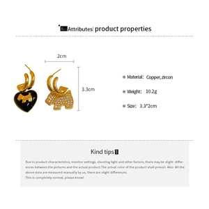 Detailed specs of gold-plated earrings with black heart and zircon puppy charms