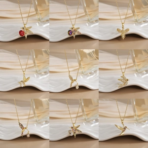Elegant gold-plated hummingbird necklace collection with micro-pave zirconia and pearls