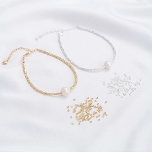 Detail of 14K gold and silver plated 2mm irregular spacer beads with a white pearl charm