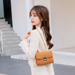 Chic sherpa crossbody bag in caramel brown with golden chain strap and metal lock