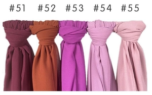 Detail view of five assorted pearl chiffon scarves in various elegant purple and red shades