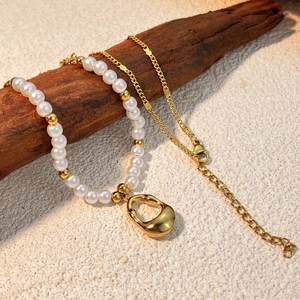Chic stainless steel layered necklace set with white pearls and gold shell pendant