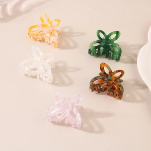 Set of five small acetate butterfly hair claws in marble and pearl finishes