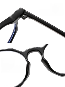 Detail of durable metal hinges and ergonomic nose pads on black polygon eyeglass frames