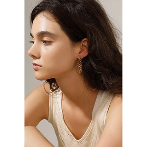Minimalist 18K gold plated stainless steel OT buckle chain earrings worn by a model