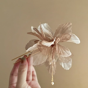 Elegant floral hair pin with champagne fabric petals and delicate pearl tassels