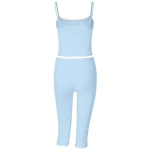 Detail of light blue ribbed knit fabric texture on camisole and leggings set