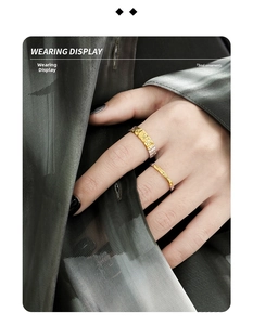 Close-up of dual-tone S925 sterling silver rings with irregular hammered lava texture