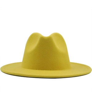 Classic mustard yellow felt fedora hat with flat brim and indented crown for autumn