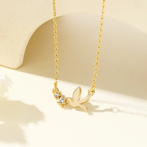Elegant 18K gold-plated stainless steel peace dove necklace with sparkling rhinestones