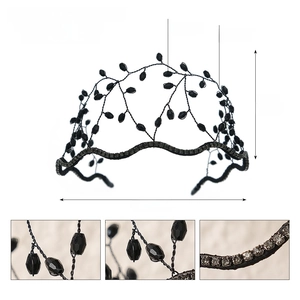 Detailed view of woven black mesh crown with crystal accents and copper wire craft