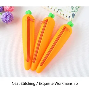 Three creative carrot-shaped silicone pencil cases with green leaf zipper pulls for students