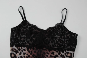 Close-up of black lace trim and leopard print fabric on a sexy camisole dress