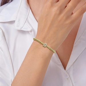 Fashionable gold beaded bracelet with a sparkling crystal letter A pendant for women