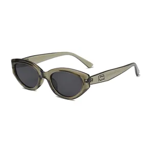Retro cat-eye sunglasses with translucent brown frames and silver B-logo on the temples
