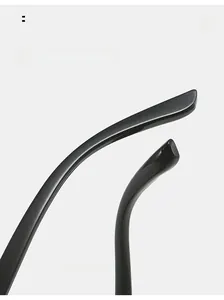 Close-up of curved glossy black ergonomic mirror legs on square frame sunglasses