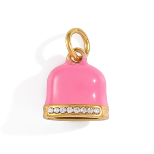 Pink bell charm with golden metal edges and sparkling crystal inlay on white background
