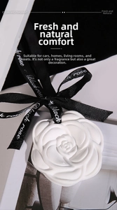 Detailed view of camellia gypsum aromatherapy stone with black ribbon for closets