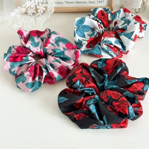French rose print satin hair scrunchies in pink, white, and black for elegant styling