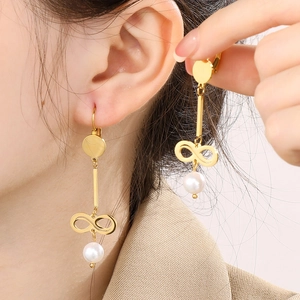 Elegant gold infinity link earrings with long pearl pendants for women on white background