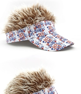 Close-up of printed lettering on white visor cap with attached brown curly wig hair