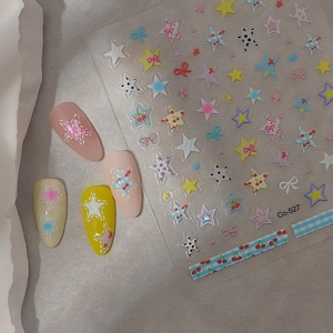 Close-up of 5D star nail art stickers Co-527 with cherry and bow patterns on nails